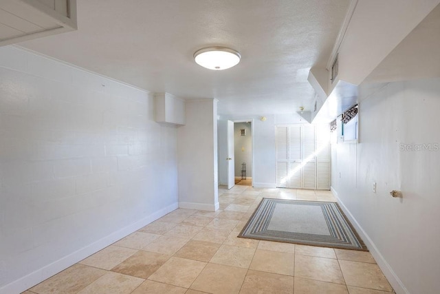 corridor with light tile patterned floors