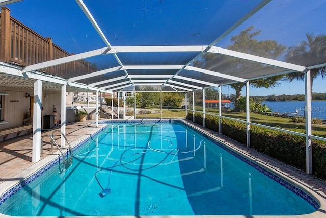 view of pool with a water view, central AC, glass enclosure, and a patio area