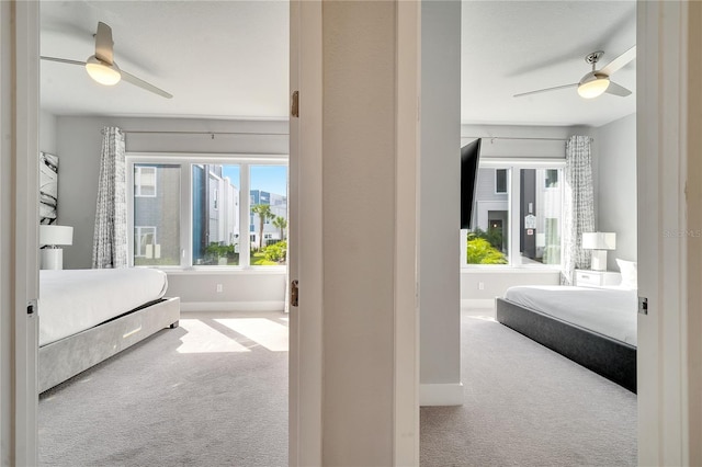 bedroom with ceiling fan and carpet flooring