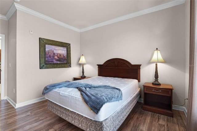 bedroom with dark hardwood / wood-style flooring and ornamental molding