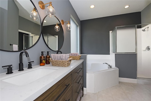 bathroom featuring vanity, plus walk in shower, and tile patterned flooring