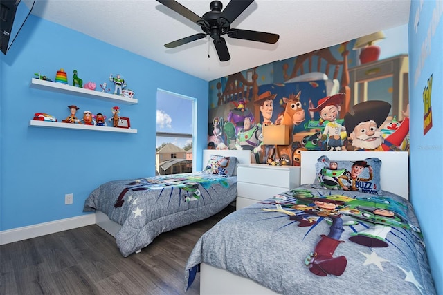 bedroom featuring ceiling fan and dark hardwood / wood-style flooring