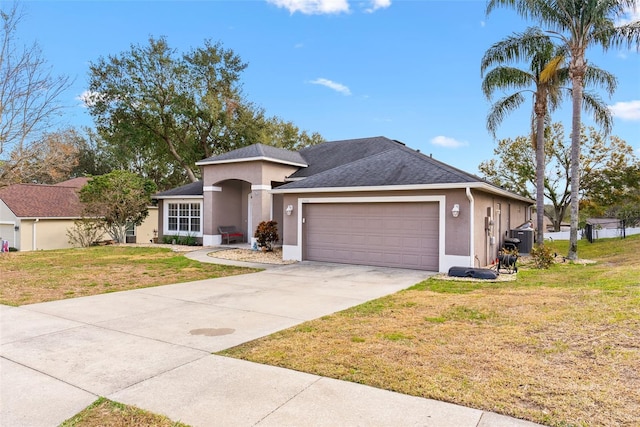 view of front of house with a garage and a front lawn