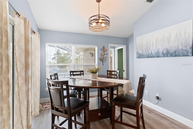 dining space featuring hardwood / wood-style floors