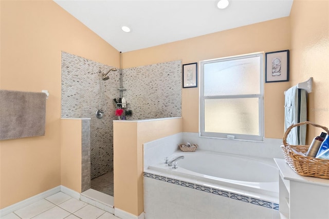 bathroom with vaulted ceiling, separate shower and tub, and tile patterned floors