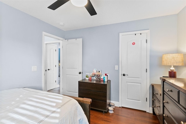 bedroom with dark wood-type flooring and ceiling fan