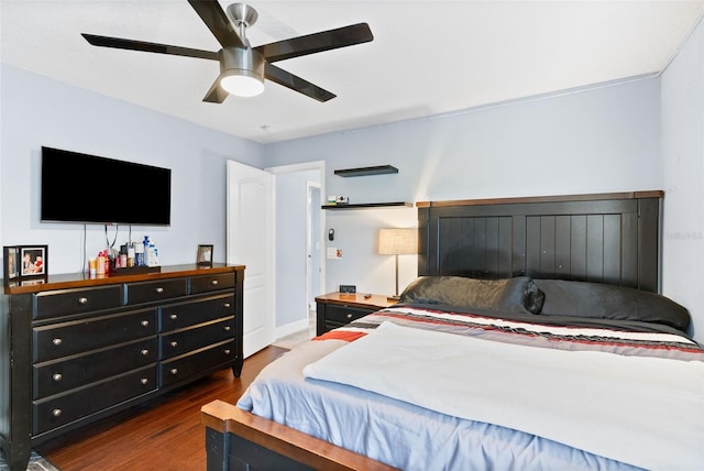 bedroom featuring dark wood-type flooring and ceiling fan