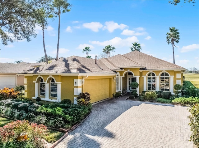 view of front of home with a garage