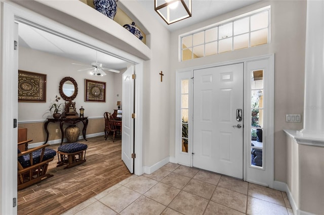 entryway featuring ceiling fan and light hardwood / wood-style flooring