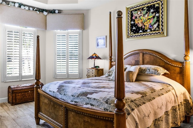 bedroom with hardwood / wood-style floors