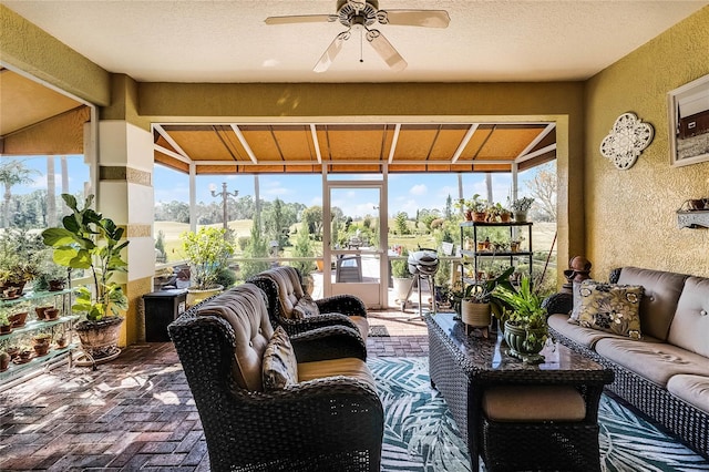 sunroom / solarium with ceiling fan and plenty of natural light