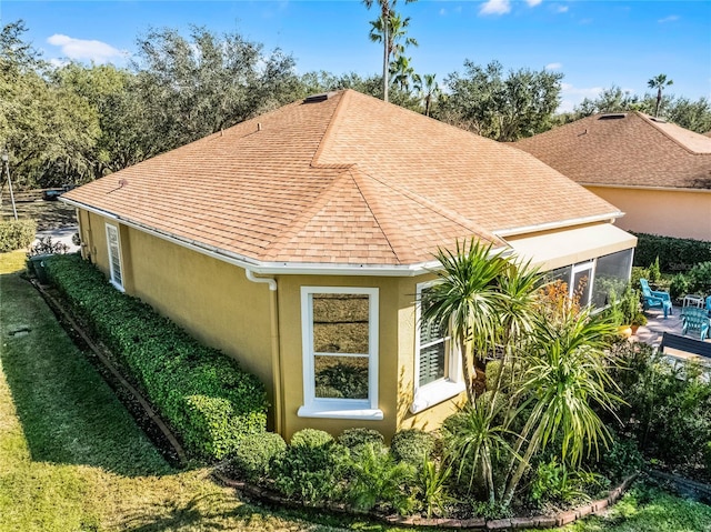 view of home's exterior featuring a sunroom