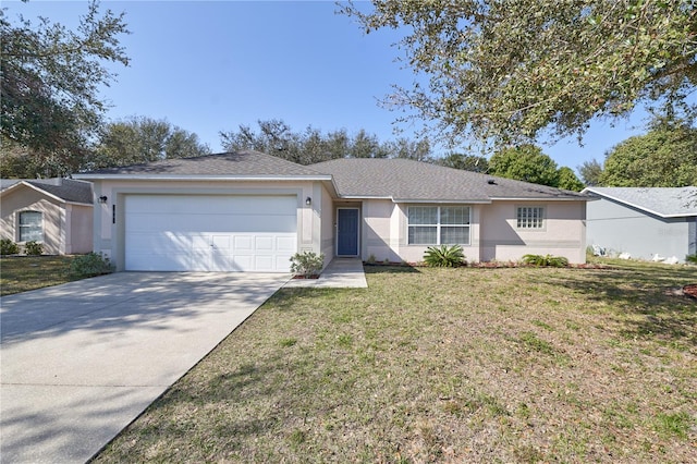 single story home with a garage and a front lawn