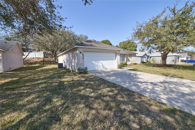 view of front facade with a garage and a front lawn