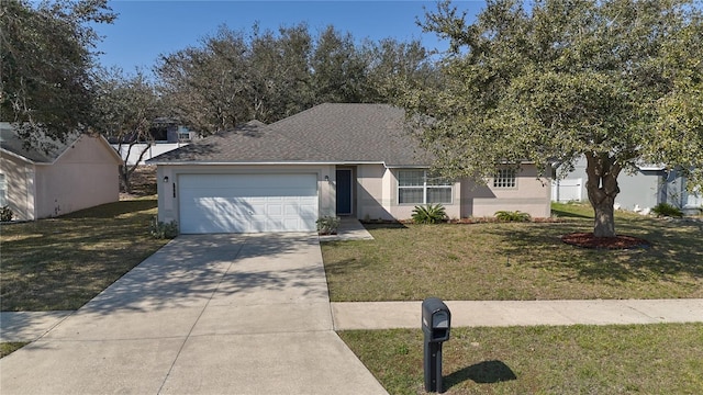 view of front of home featuring a garage and a front yard