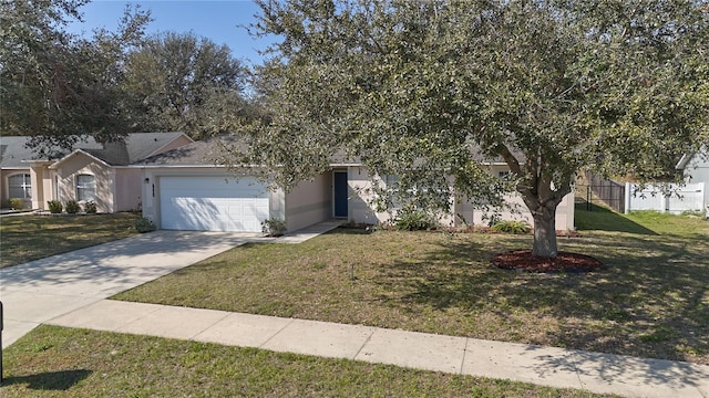 obstructed view of property with a garage and a front yard