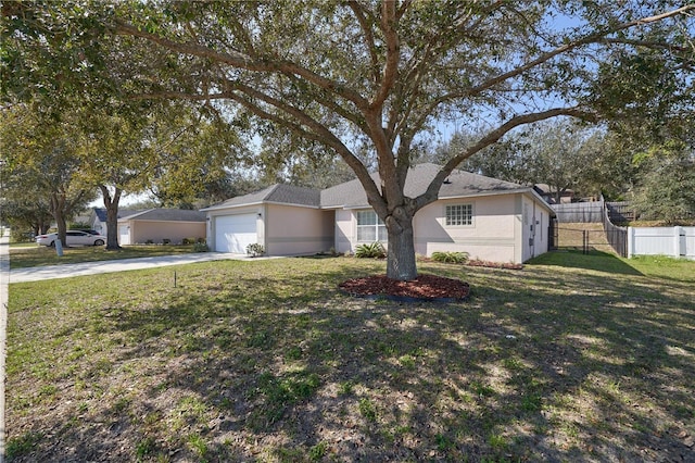 ranch-style home with a garage and a front yard