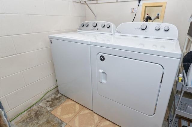 washroom with independent washer and dryer