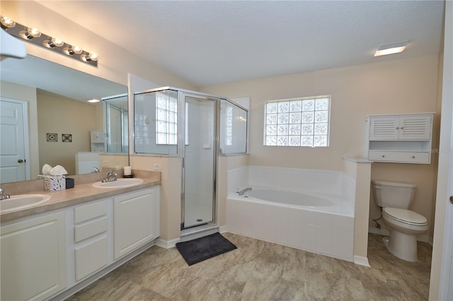 full bathroom with vanity, a textured ceiling, toilet, and separate shower and tub