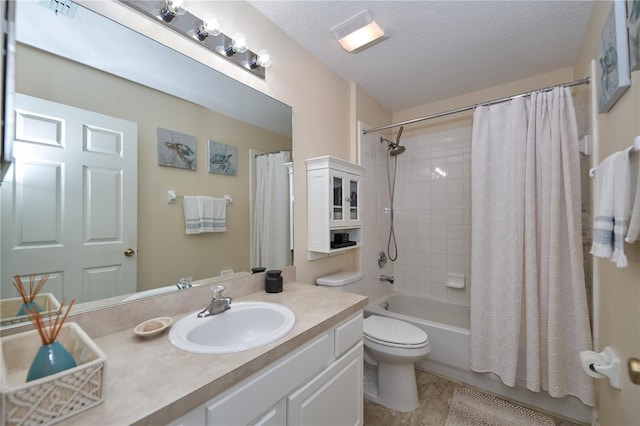 full bathroom with vanity, toilet, a textured ceiling, and shower / bath combo