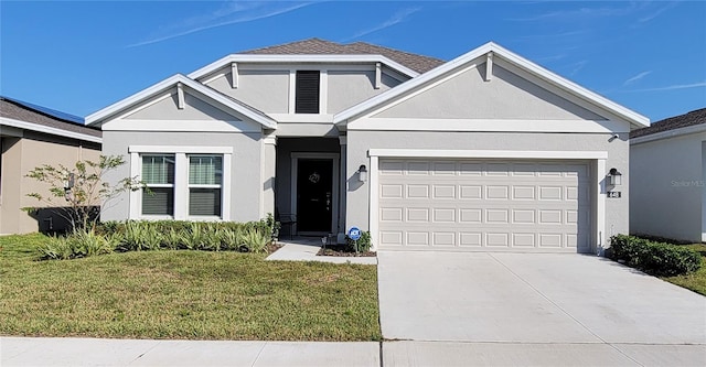 view of front facade with a garage and a front yard