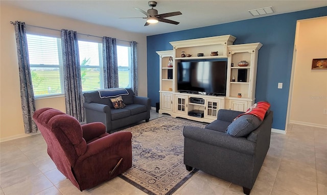 living room with light tile patterned floors and ceiling fan