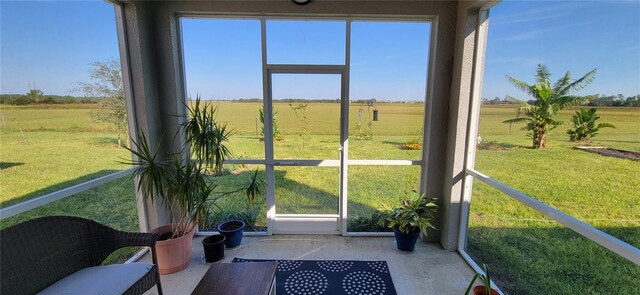 sunroom / solarium with a rural view