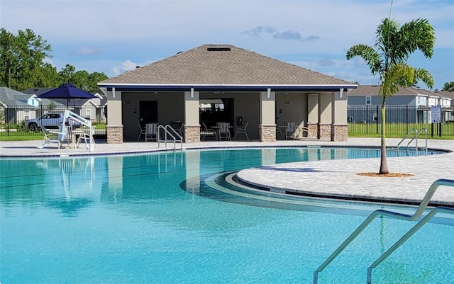 view of swimming pool featuring a patio area