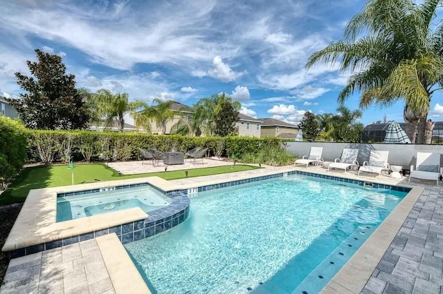 view of pool featuring an in ground hot tub and a patio