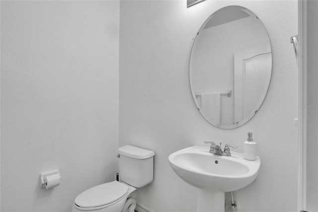 bathroom with sink and toilet