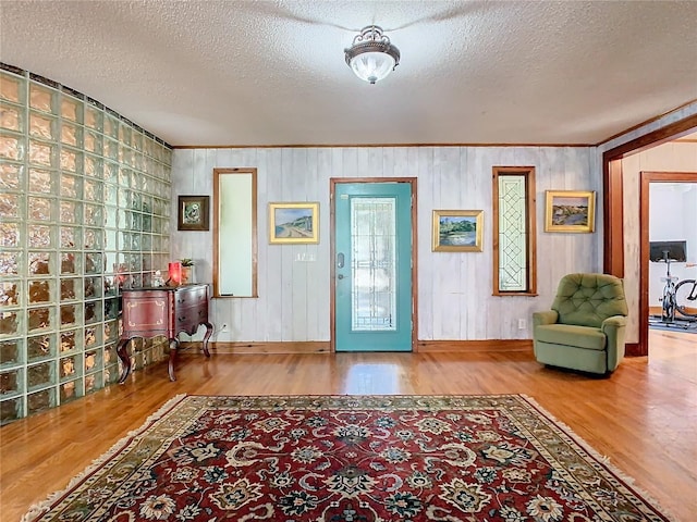 entrance foyer featuring hardwood / wood-style flooring and a textured ceiling