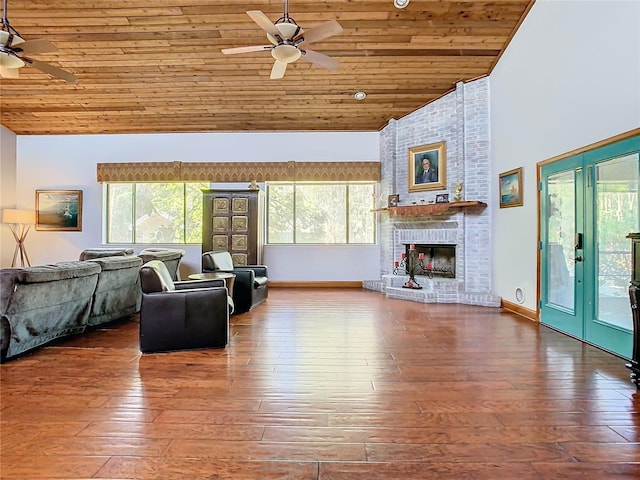 living room with high vaulted ceiling, wooden ceiling, ceiling fan, a fireplace, and hardwood / wood-style floors