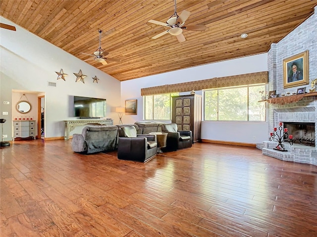 living room with a brick fireplace, wood-type flooring, high vaulted ceiling, and wooden ceiling