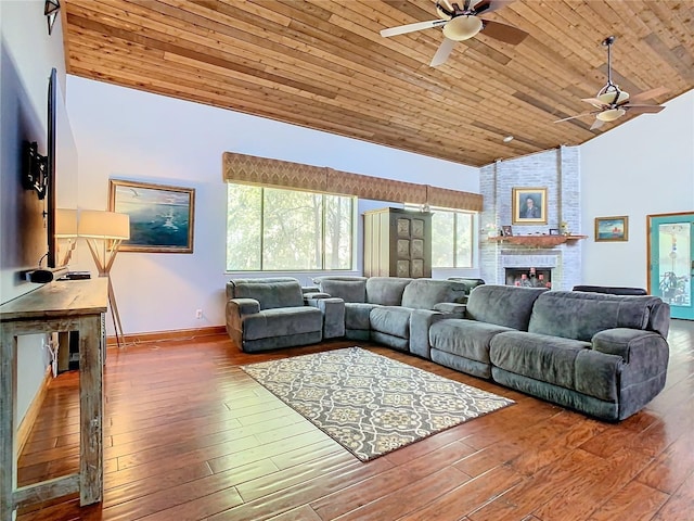 living room with high vaulted ceiling, hardwood / wood-style flooring, ceiling fan, wood ceiling, and a brick fireplace