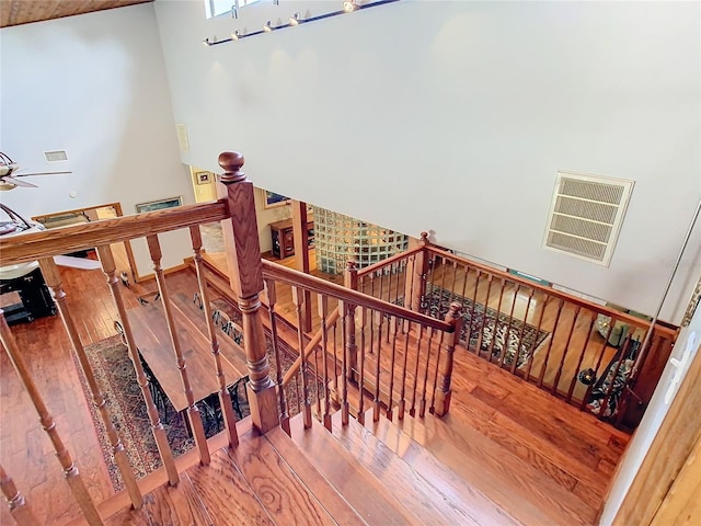 staircase with hardwood / wood-style flooring