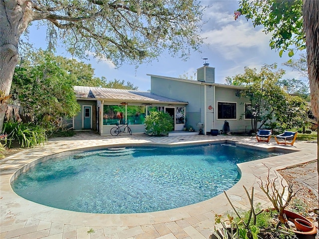 view of swimming pool with a patio