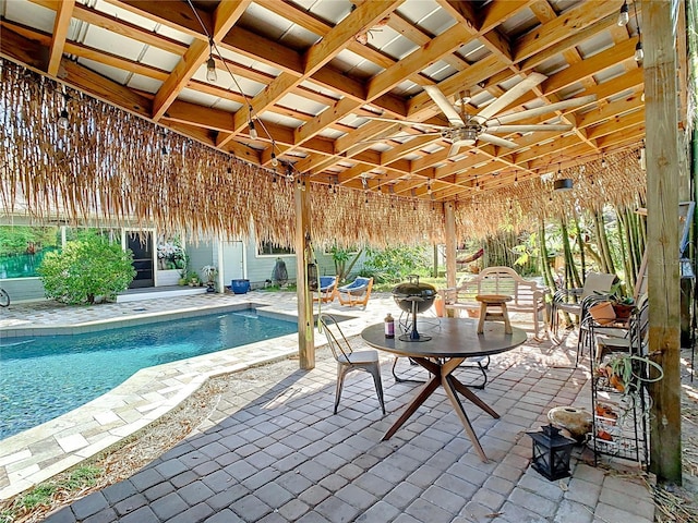 view of pool featuring ceiling fan and a patio