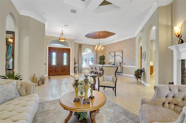 tiled living room featuring crown molding and a chandelier