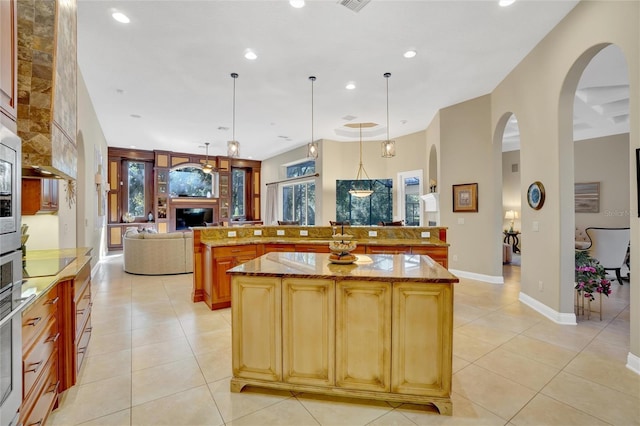 kitchen featuring a large island, pendant lighting, and light tile patterned floors