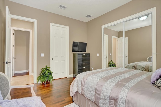 bedroom with hardwood / wood-style floors