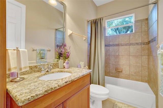 full bathroom with shower / tub combo with curtain, vanity, and toilet