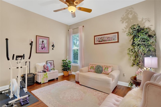 interior space with wood-type flooring and ceiling fan