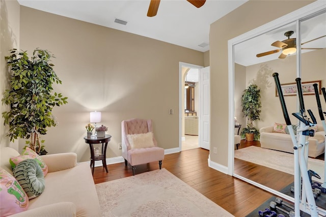 interior space featuring hardwood / wood-style floors and ceiling fan