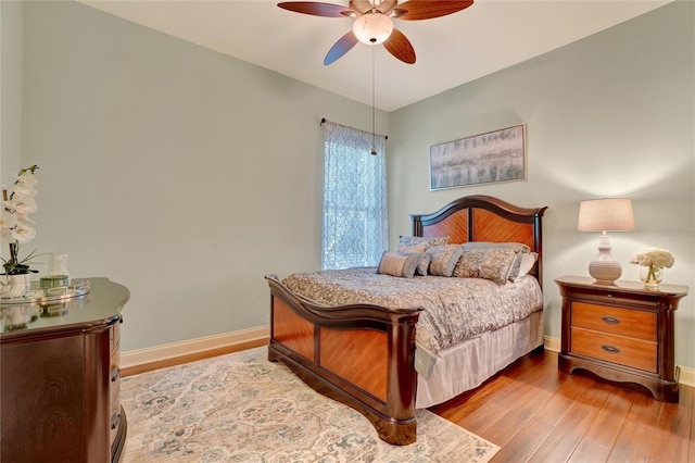 bedroom featuring ceiling fan and light hardwood / wood-style flooring