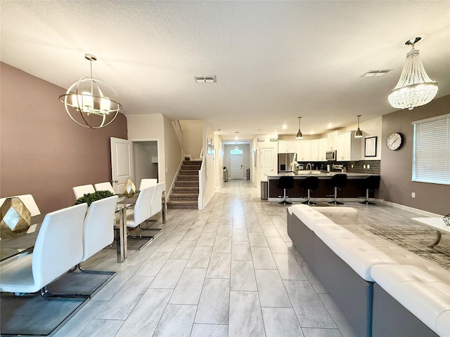 dining area featuring a chandelier