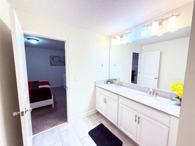 bathroom featuring vanity and a textured ceiling