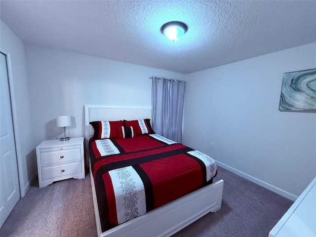 carpeted bedroom with a textured ceiling