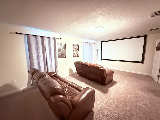 home theater with carpet floors and a textured ceiling