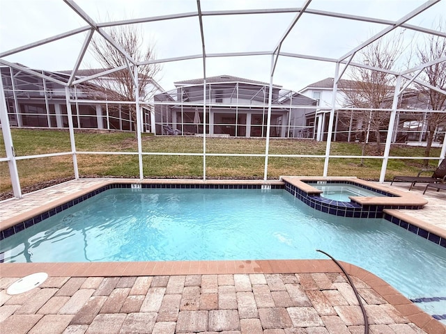 view of pool with a yard, a lanai, a patio, and an in ground hot tub