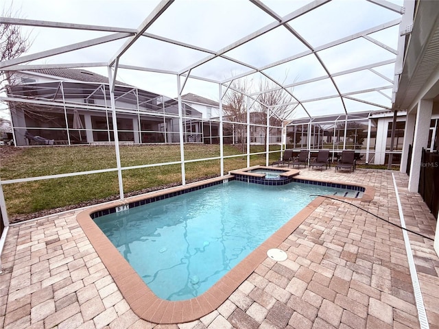 view of pool featuring an in ground hot tub, a yard, glass enclosure, and a patio area